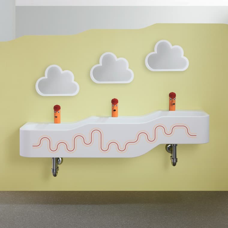 Geberit Bambini karmen kırmızısı ve turuncu oyun ve tuvalet alanı Geberit Bambini karmen kırmızısı ve turuncu oyun ve tuvalet alanı